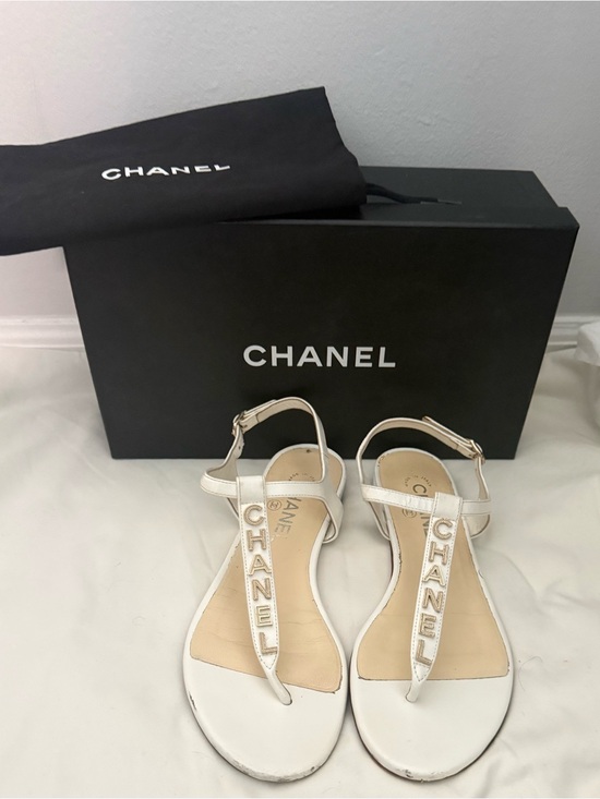 CHANEL Shoes - CHANEL White Leather Logo T-Strap Sandals